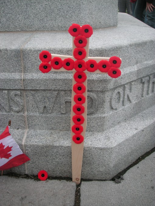 Commemorative cross decorated with poppies.